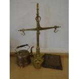 Hanging brass scales, a copper kettle and plaque