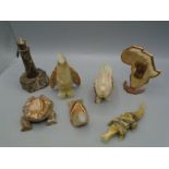 Collection of onyx figures and a serpentine rock lighthouse