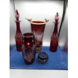 Bohemian red glass collection- a pair of decanters, a tall vase with metal rim with birds and an