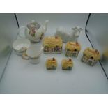 A tea pot, butter dish x2 milk jug and sugar bowl, 2 cottage style condiment pots and salt and