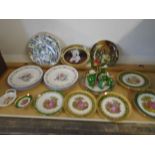 A collection of decorative plates including Royal Worcester