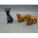 Pottery Highland cattle and a cat
