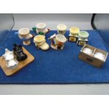 Wedgwood, Royal Doulton bunnykins and Peter Rabbit mugs, a collection of novelty egg cups and salt