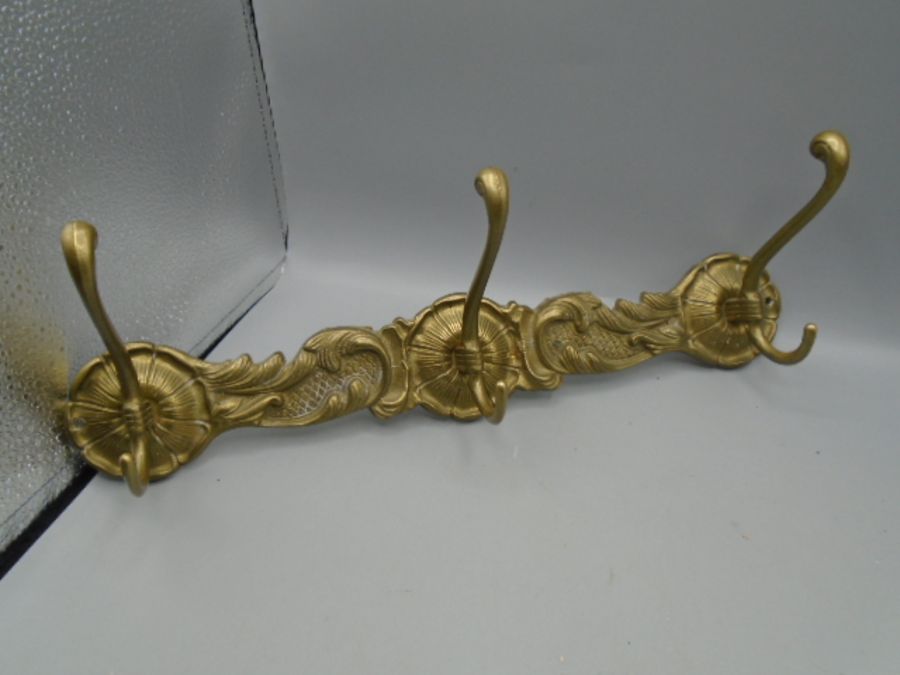 A brass peg rail