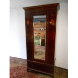 Edwardian mahogany and inlaid wardrobe with one bevelled mirrored door upon 1 drawer H210cm W102cm