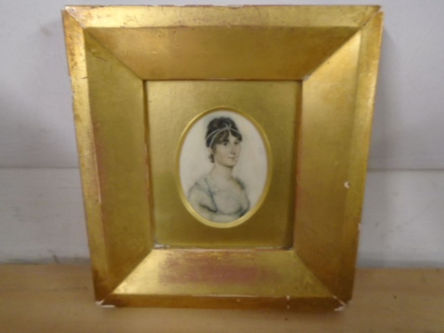 A small portrait of a lady in a guilt frame 14x15cm