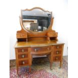 Edwardian flame mahogany and inlaid dressing table with bevelled glass top and central shield shaped
