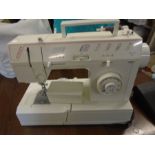 Singer electric sewing machine with manual and accessories