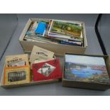 Postcards, a shoe boxes and 2 other small boxes containing postcards, many U.K and around the world.
