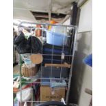 Stillage containing new toilet seats, luggage, china (Carlton Ware, Clarice Cliff), books etc.