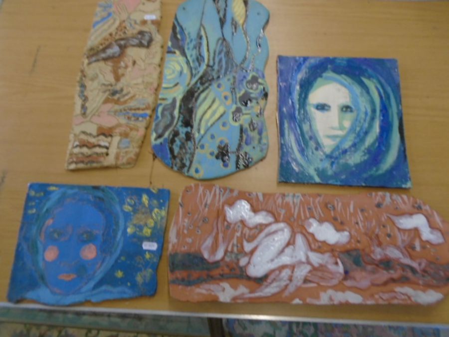 5 plaques made in crank clay depicting various abstract images made by a local artist