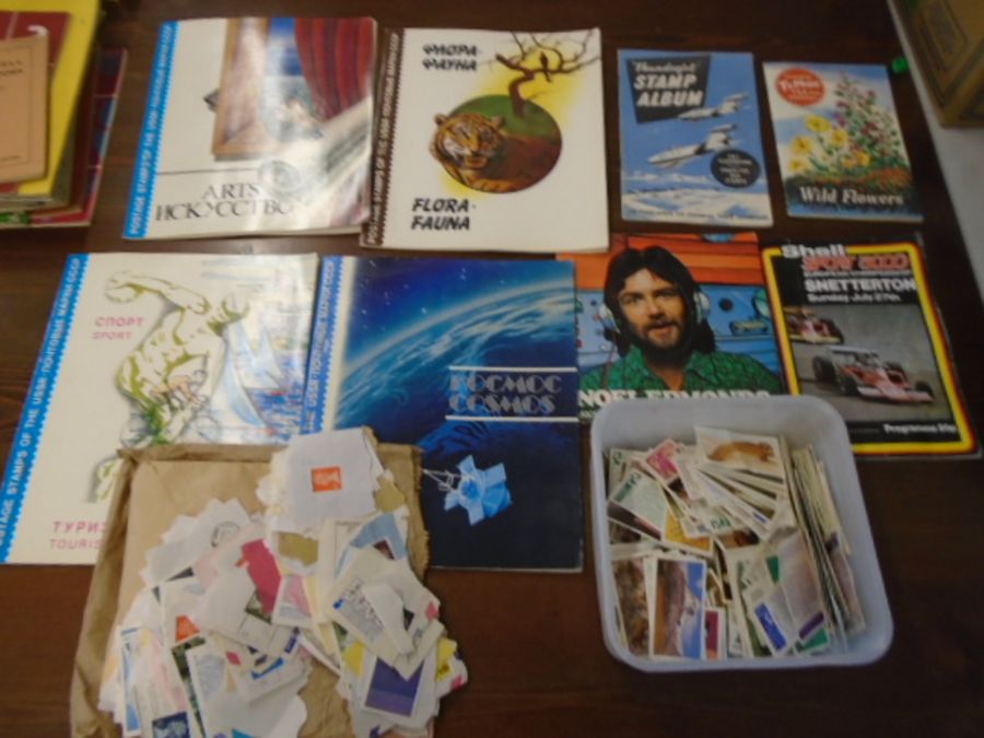 A signed Noel Edmunds Shell sport programme, stamp album, loose stamps and a few cigarette cards
