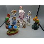 A Chinese yixing teapot, vintage figurines of various people, German bird figures, Guiness ashtray