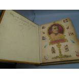 A Victorian scrap book full of cut out pictures