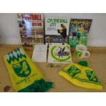 Norwich city football club memorabillia- 2 books, an invitation, a mug, a few brooches, scarf and