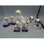 Staffordshire miniature dogs, cats, a poodle