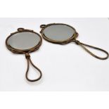 A pair of bevel edged dressing table hand mirrors