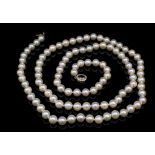 Pearl opera length necklace with a sapphire