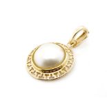 Mabe pearl and 9ct yellow gold enhancer