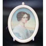 Early ivory frame with a portrait of a young lady