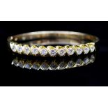 Diamond and yellow gold hinged bangle