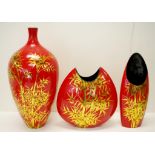 Three large red coloured lacquer ware vases