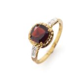 Garnet and 9ct yellow gold ring