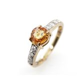 Golden sapphire and diamond ring