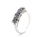 Blue and white diamond set white gold ring