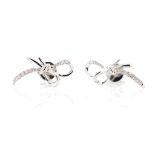 Diamond and 18ct white gold "bow" stud earrings