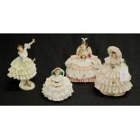 Four various Dresden lace figures