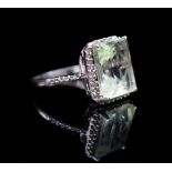 Green amethyst and diamond halo ring