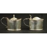 Two Edwardian oval sterling silver mustard pots