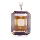 A large smoky quartz and 18ct yellow gold pendant