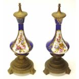 Pair of French porcelain & brass garnitures