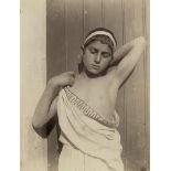 Gloeden, Wilhelm von: Young boy in toga with headband