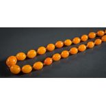 A graduated amber bead single-string necklace: composed of forty-six oblong beads graduated from 13.