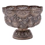 An Indian silver bowl: of lobed circular outline, with embossed decoration of figures,