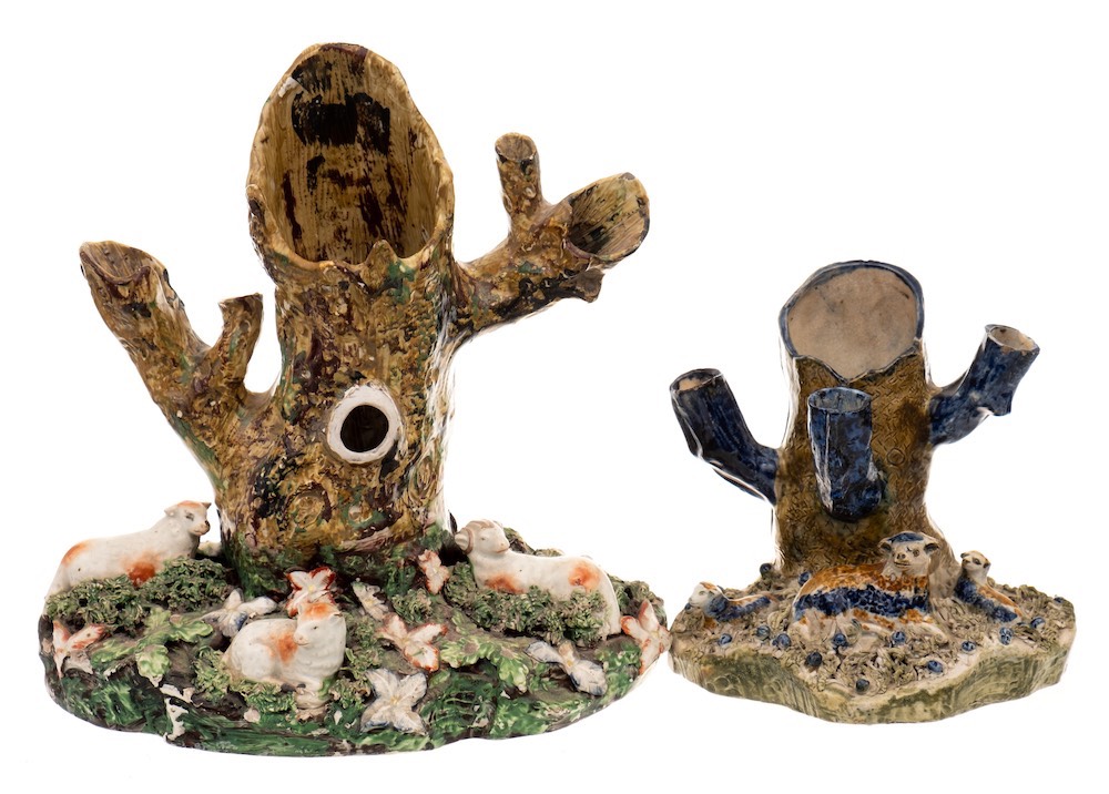 A large early 19th century Staffordshire sheep and tree trunk spill group and one similar: the