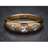 A gentleman's 18ct gold and diamond three-stone gypsy-set ring: set with round old,