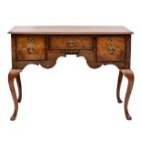 A walnut lowboy in the early 18th Century taste:,