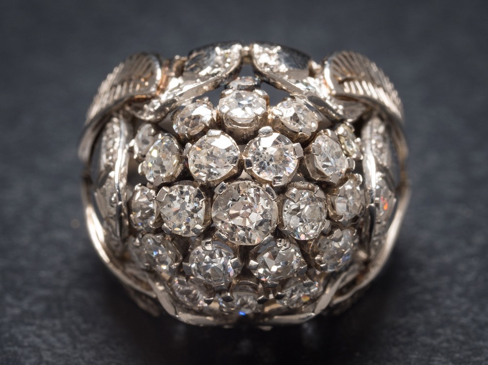 A diamond bombe cluster ring: with central cluster of round old brilliant-cut diamonds estimated to