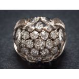 A diamond bombe cluster ring: with central cluster of round old brilliant-cut diamonds estimated to