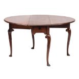 A George II mahogany oval drop leaf dining table:, with a hinged top,
