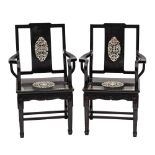 A pair of Chinese black lacquer and mother of pearl inlaid open armchairs:,