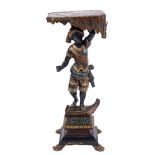 A Continental carved wood and decorated Blackamoor figure:,