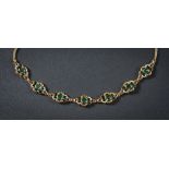 An enamelled and green tourmaline mounted necklace: with openwork links each inset with a single