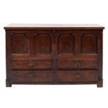An 18th Century oak rectangular mule chest:, with a plain hinged top,