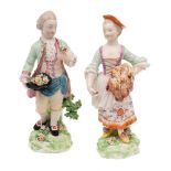 A pair of Derby figures of children emblematic of Spring and Summer: the boy holding a posy in one