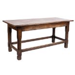 An oak refectory table:, with a cleated plank top on square section and chamfered legs,